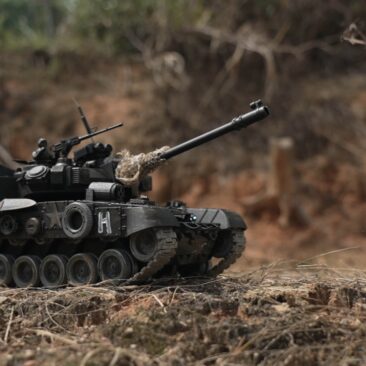 Iron Vanguard Alloy RC Tank showcasing turret rotation and rugged terrain capability