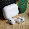 Apple AirPods Pro 2 wireless earbuds with iPhone showcasing seamless Apple ecosystem integration.