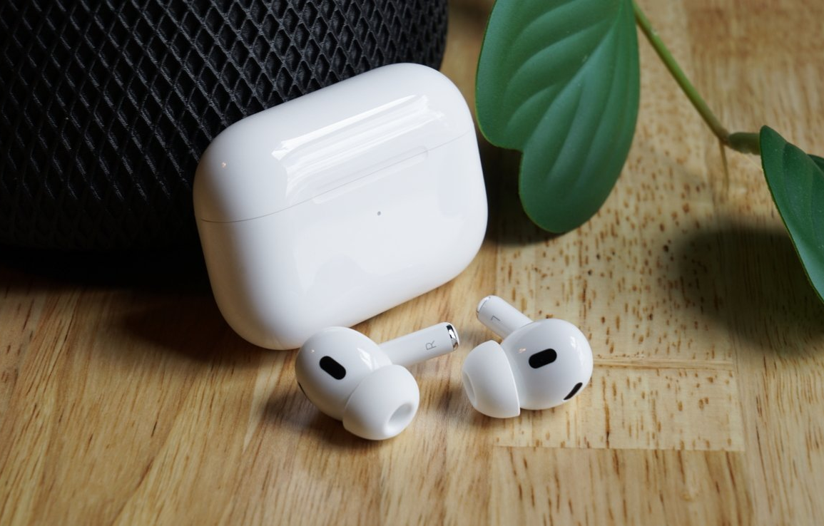 Apple AirPods Pro 2 wireless earbuds with iPhone showcasing seamless Apple ecosystem integration.